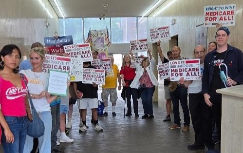 Rally participants end their march inside the building where Rep Pou’s office is located.
